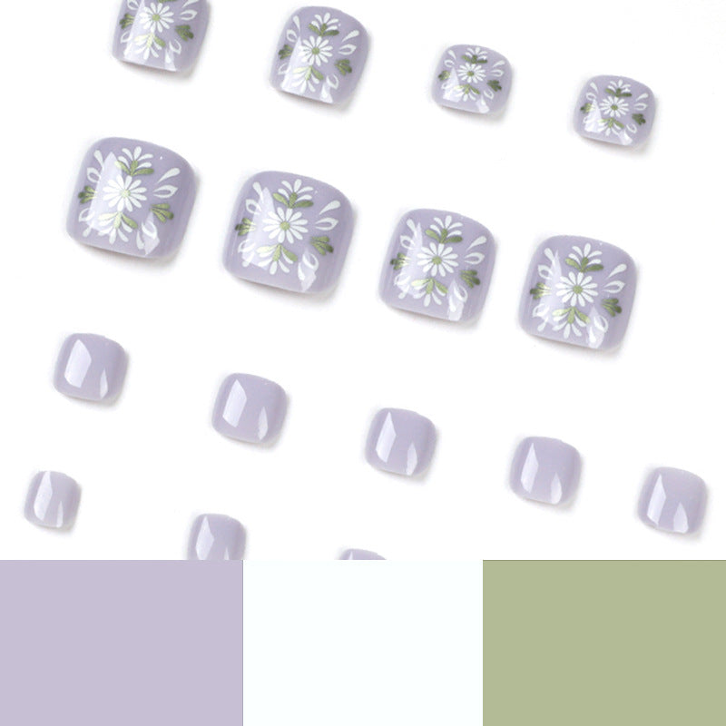Artistic toenail design with elegant floral design Kalsten