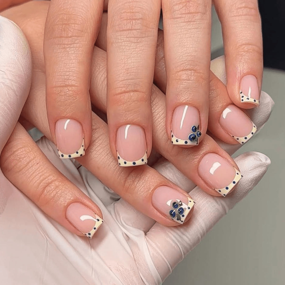 Elegantly designed nail extensions with decorative accents Kalsten
