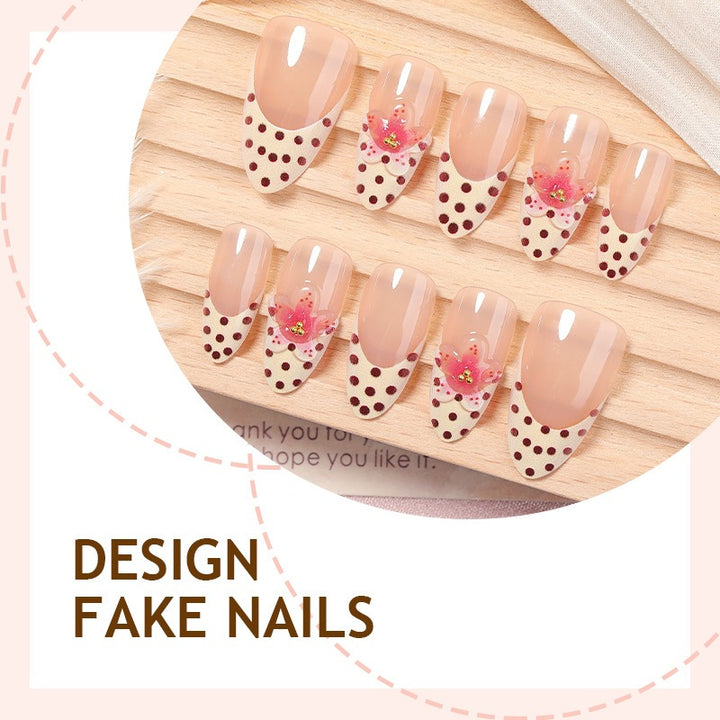 Acrylic nail set with romantic dots and floral accents Kalsten