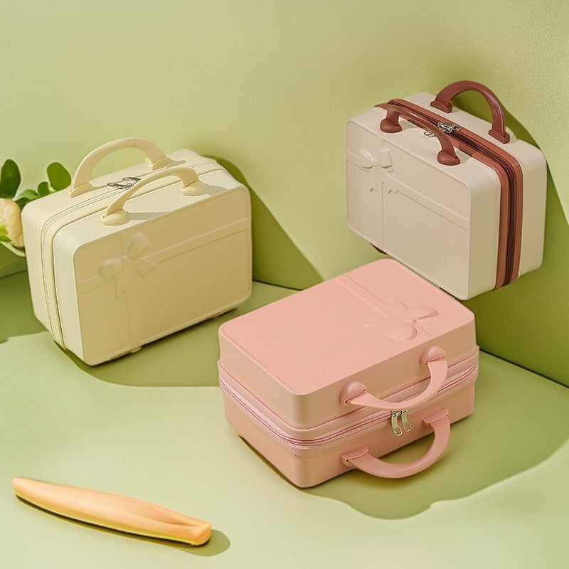 structured hard-shell cosmetic travel case with embossed bow and dual top handles Kalsten