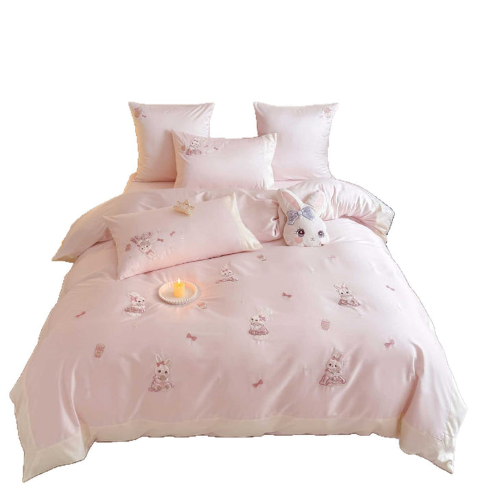 Children's bedding set with embroidered bunny appliqués and satin trim
