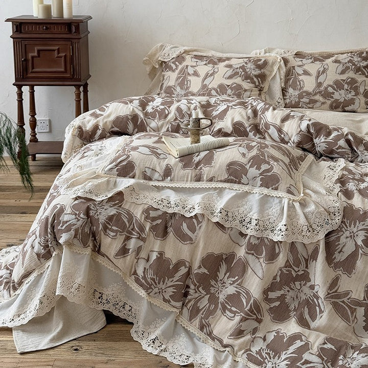Vintage-inspired cotton-linen bedding set with large floral pattern, ruffle, and lace appliqué