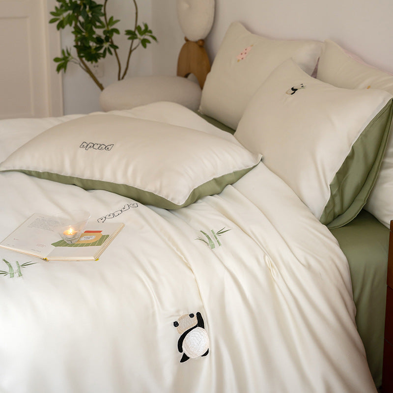 Luxurious satin bedding set with embroidered cherry motifs, reversible function and plush bunny pillow
