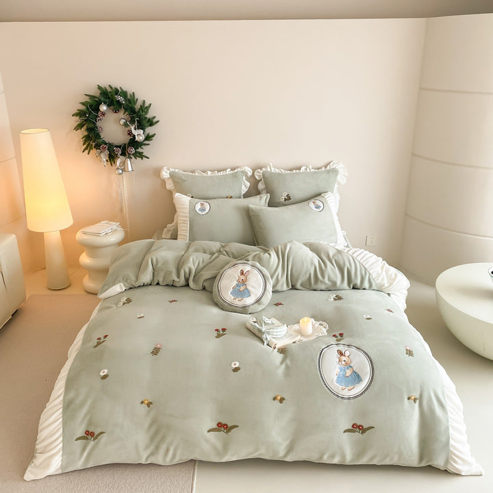 Quilted children's bedding set with embroidered bunny appliqués and ruffles