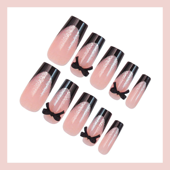 Artificial nail set with elegant glitter accents and bow details Kalsten