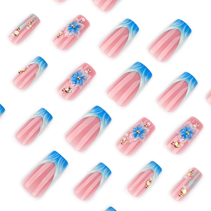 Artful nail art with floral accents and glitter effects Kalsten
