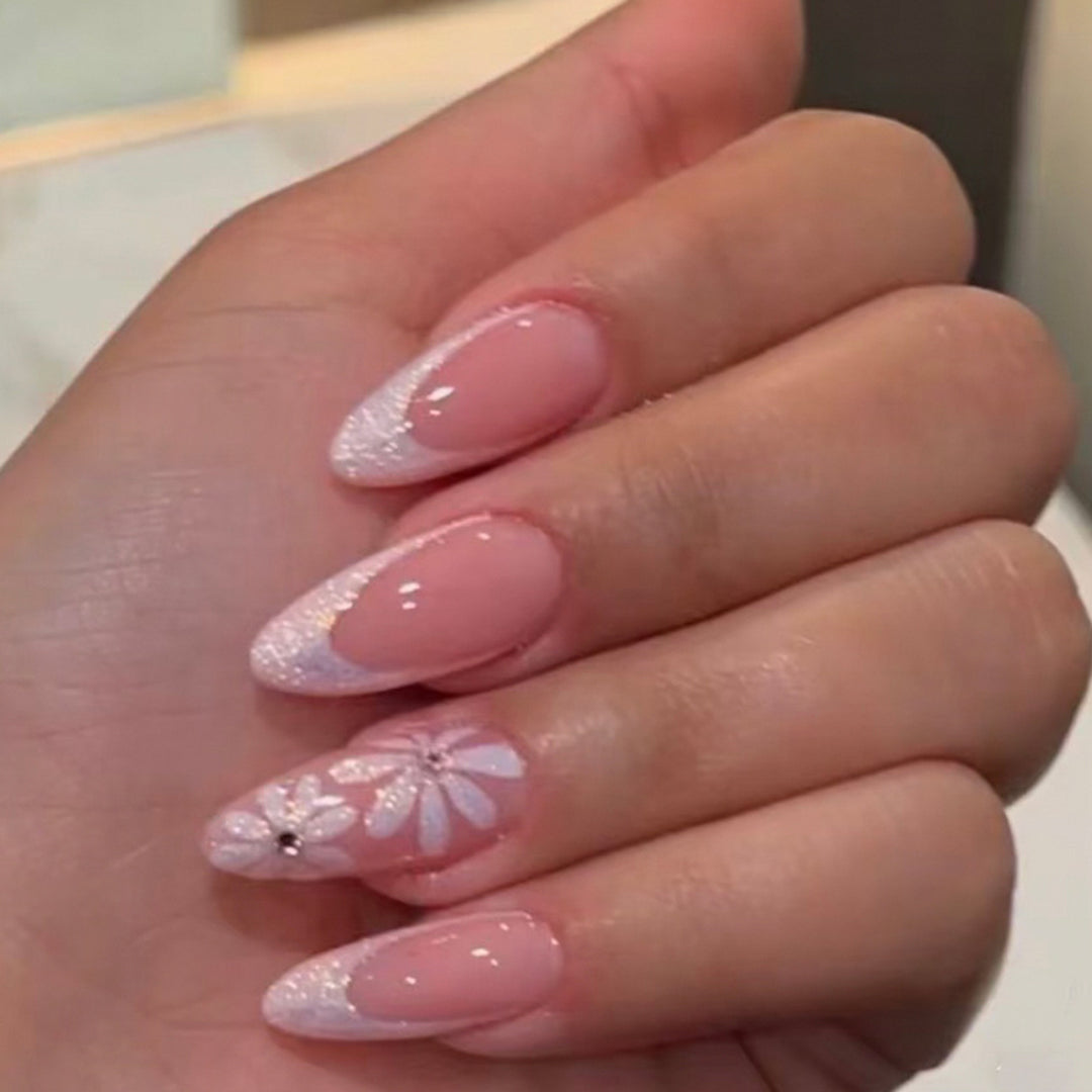 Artful Nail Art with Flower Design and Blue French Tip Kalsten