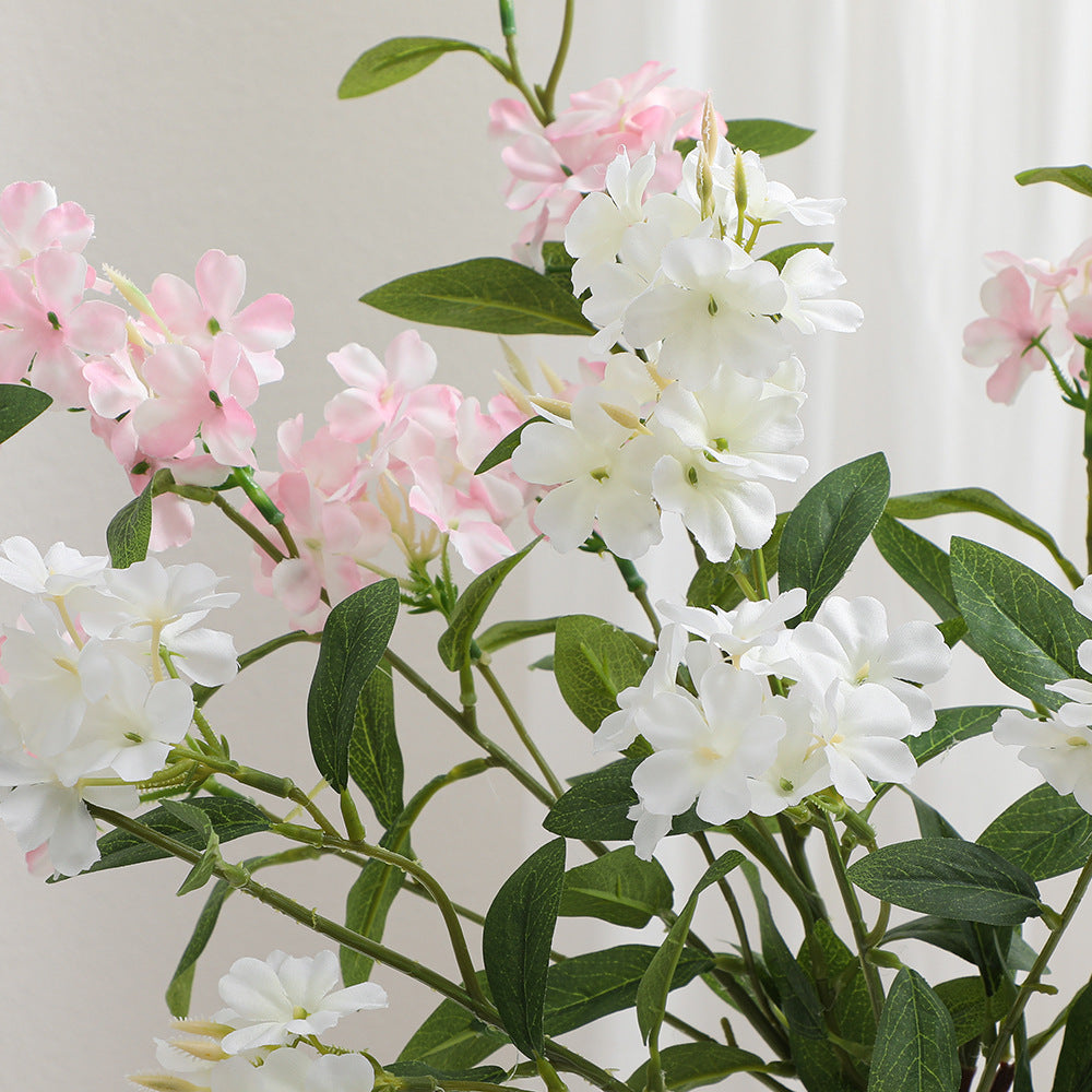 Decorative art branch with white flowers