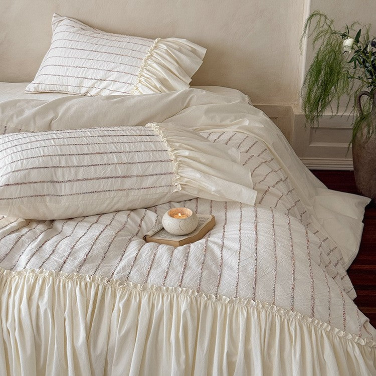 Bedding set made of cotton percale with striped relief embroidery and ruffled bed skirt