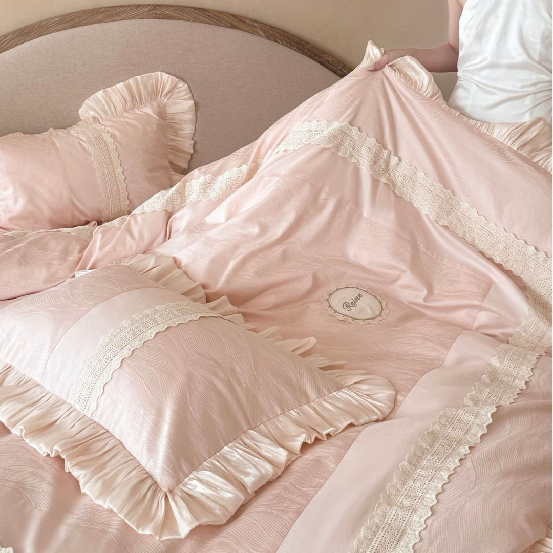 Duvet cover set with ruffle trim, fine lace border, and subtle jacquard structure