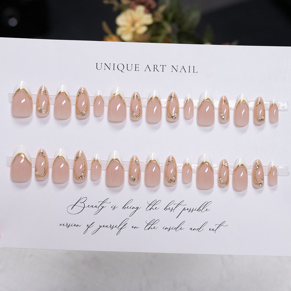 Decorative Press-On Nail Art with Gold Accents