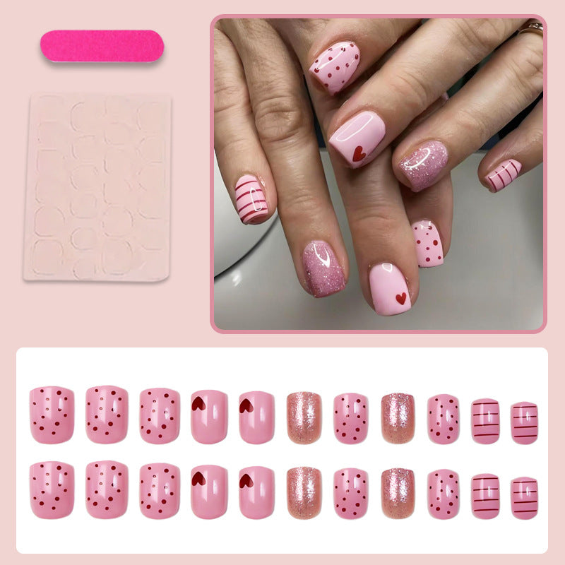 Acrylic nail set with playful hearts and glitter accents Kalsten