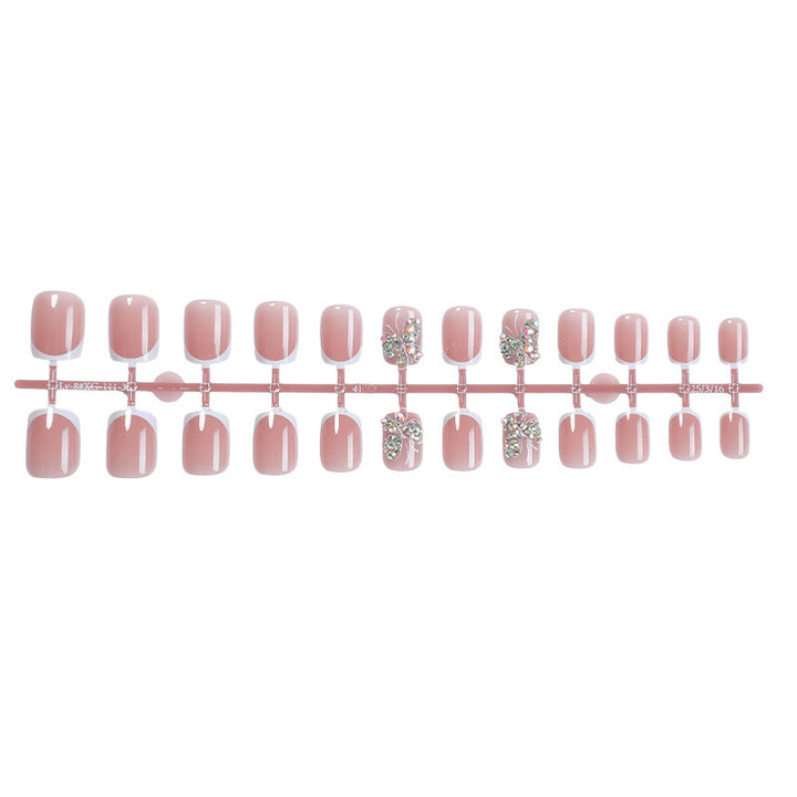 Artifical nail set with sparkling accents and elegant bows Kalsten