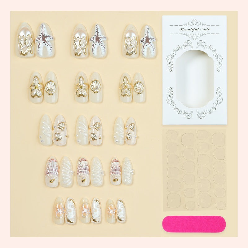 luxurious artificial nail set with maritime designs and golden accents Kalsten