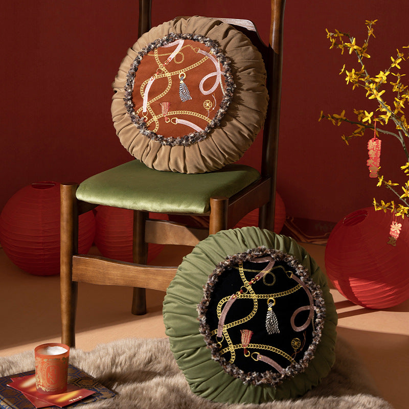 Round decorative cushion with pleated hem and embroidered central panel