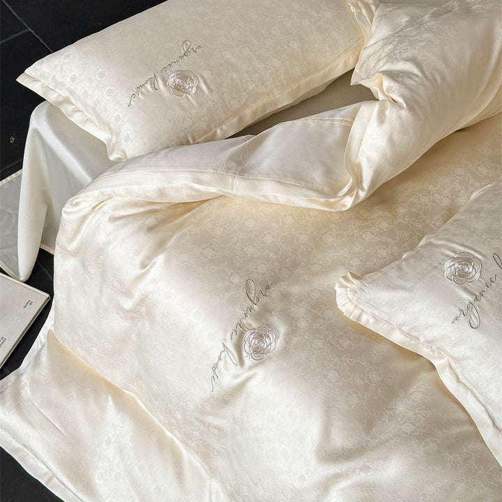 Luxurious cotton satin bedding set with jacquard relief and embroidered rose motif