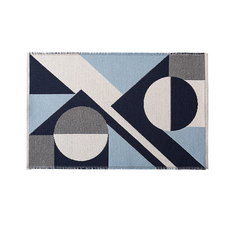 Flat-woven living room rug in a graphic tile pattern