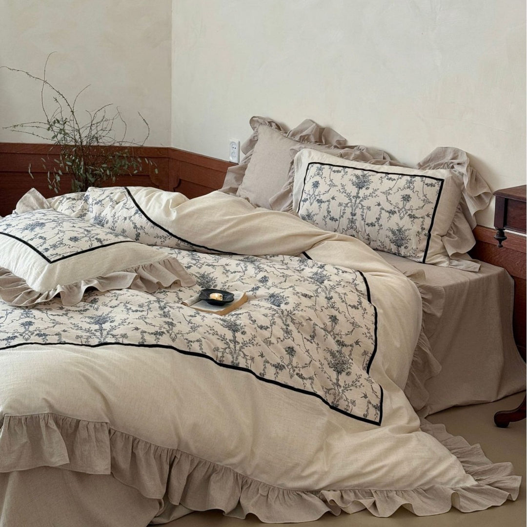 Romantic linen-look bedding set with ruffle, quilted center panel, and fine floral jacquard