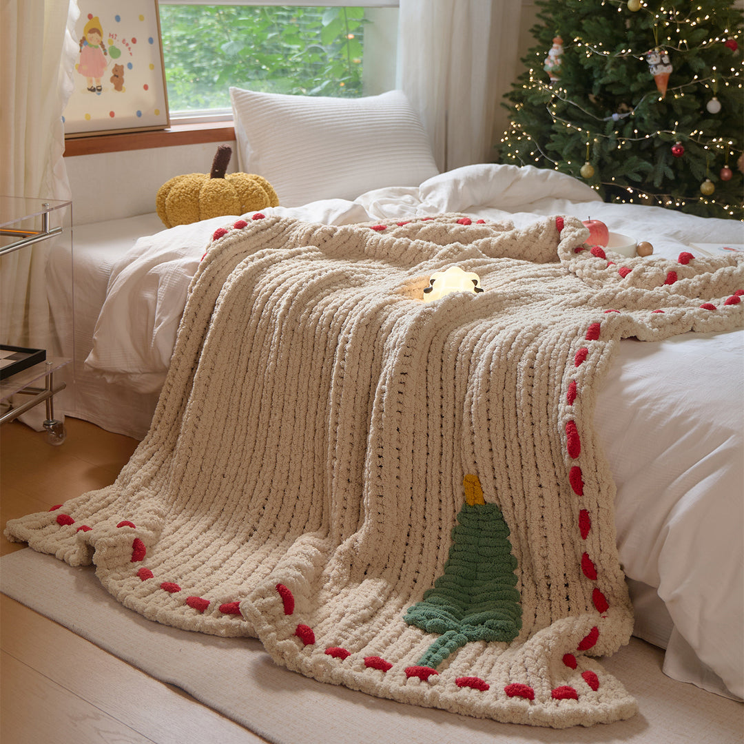 Cozy daybed cover with relief teddy structure, fir motif, and contrasting decorative seam