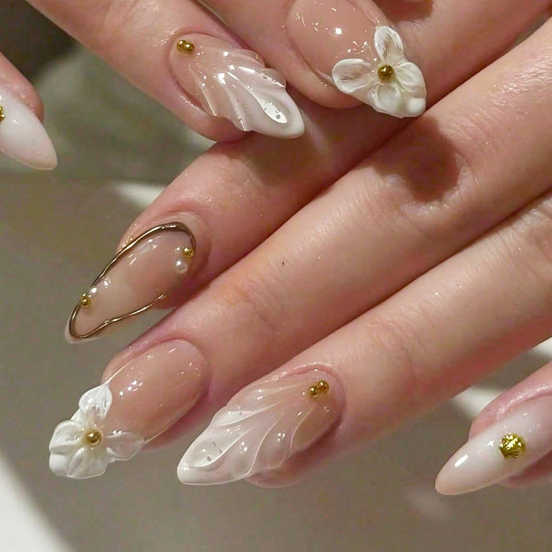 Acrylic nail set with floral 3D designs and elegant golden accents Kalsten