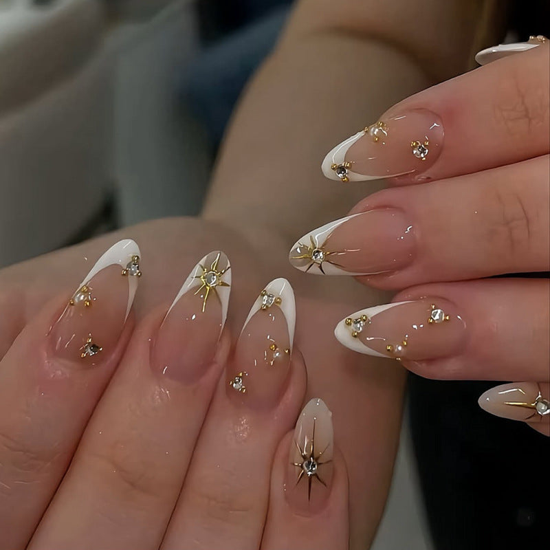 Glamorous nail art with rhinestones and gold accents Kalsten