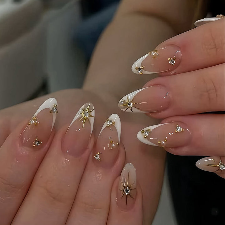 Glamorous nail art with rhinestones and gold accents Kalsten