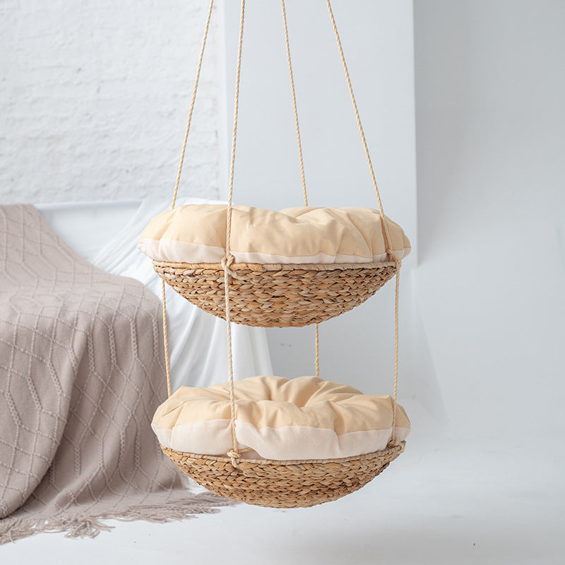 Hanging chair made of braided natural material with comfortable cushions Kalsten