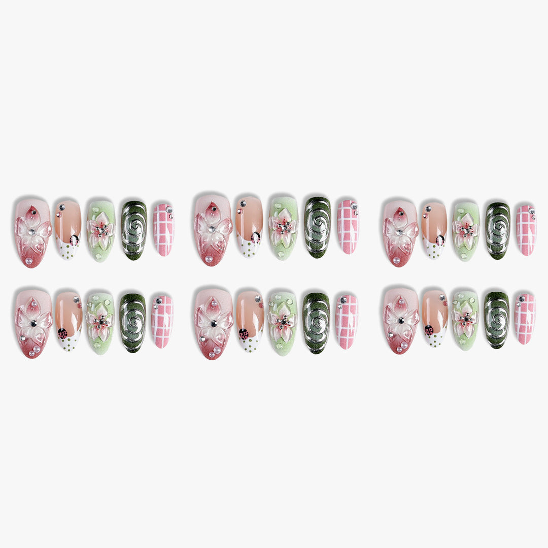Artificial nail set with floral accents and glitter details Kalsten
