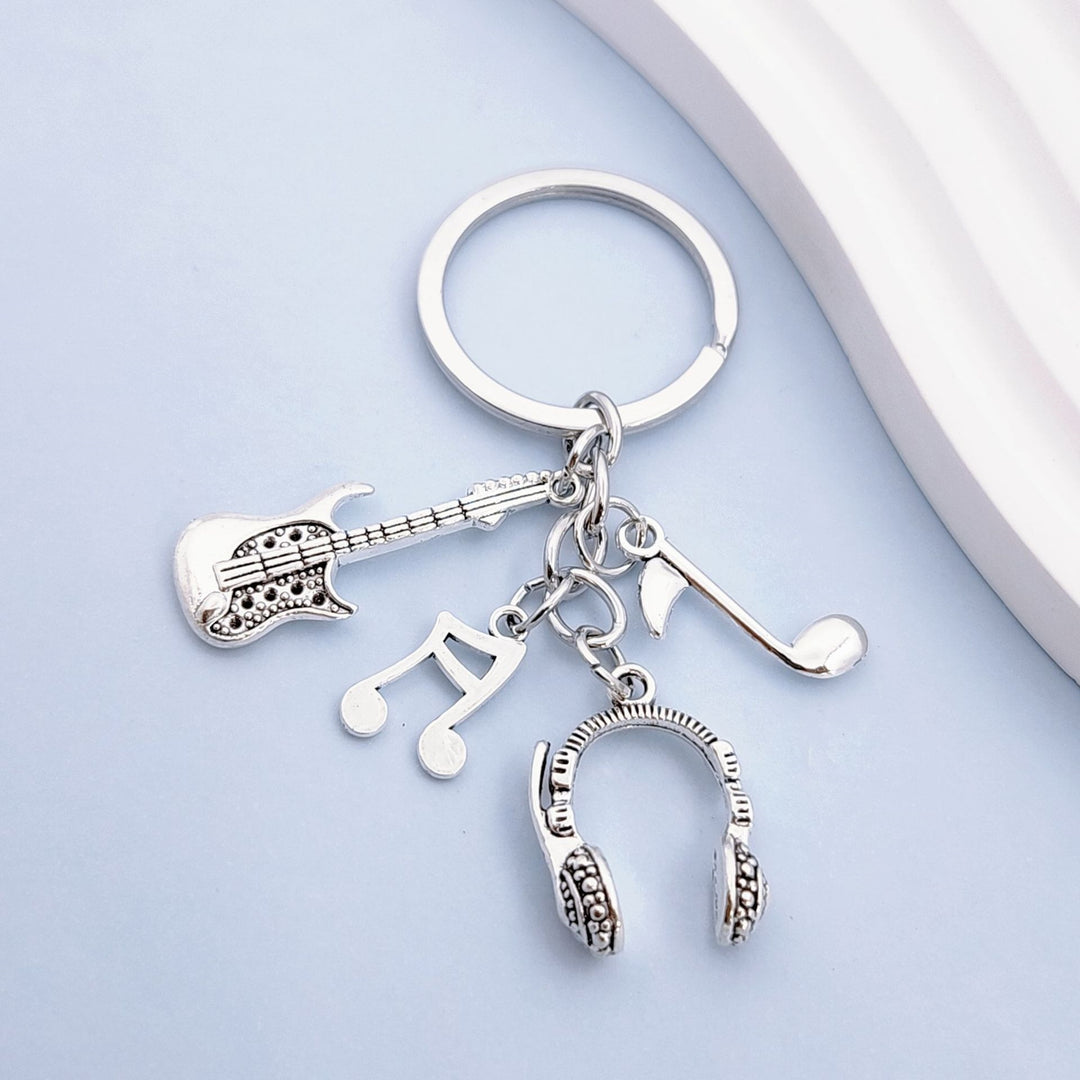Keychain with musical instruments motifs Kalsten