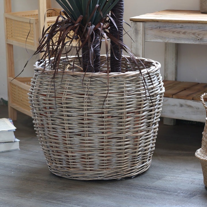Stylish laundry basket made of braided natural material Kalsten
