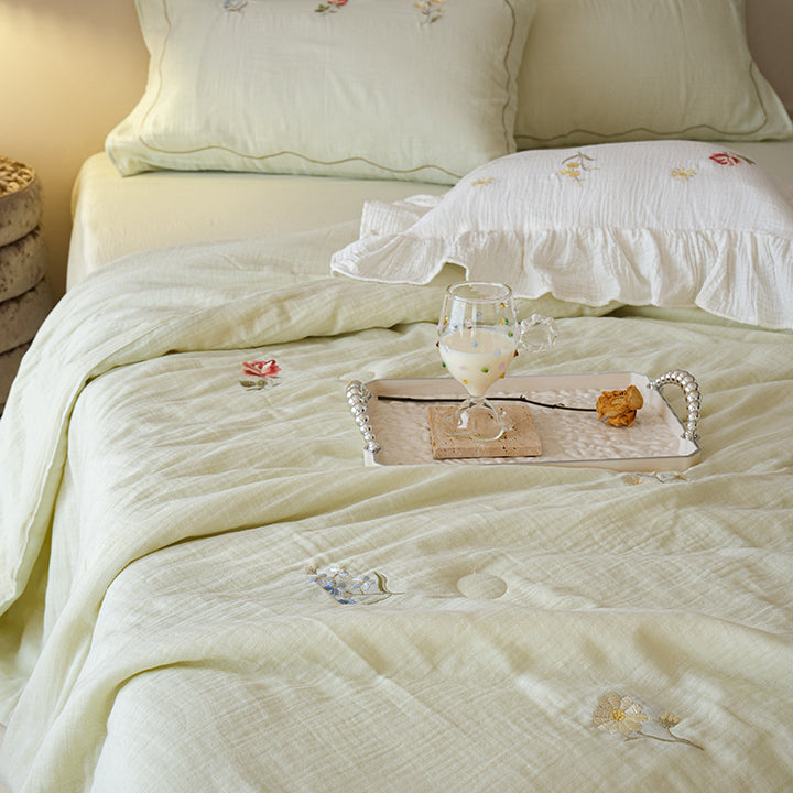 Light cotton gauze bedding set with fine floral embroidery and ruffle trim