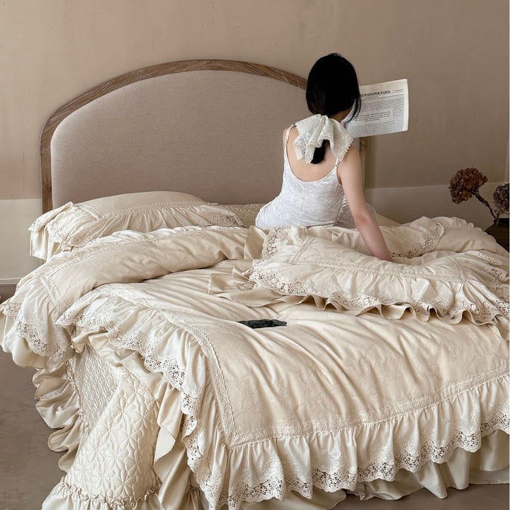 Vintage-inspired bedding set with layered ruffles and lace inset