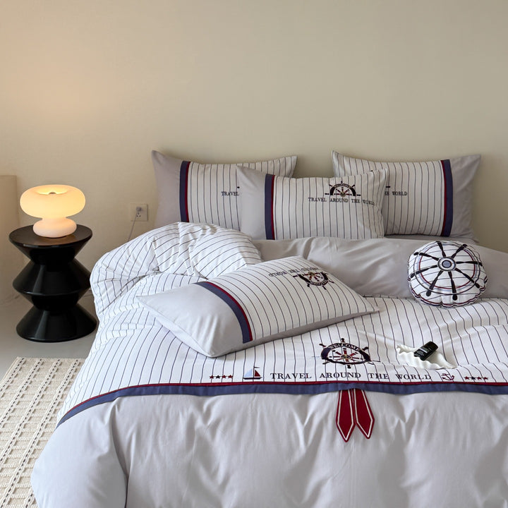 Maritime bedding set made of cotton satin with embroidered steering wheel and fine pinstripes
