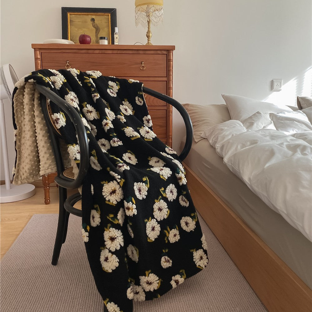 Cuddly blanket with floral bouclé surface and minky reversible fleece
