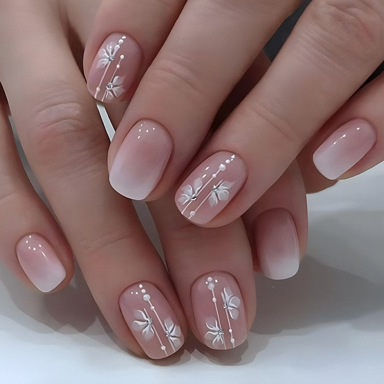 Artificial nails in elegant French tip design Kalsten