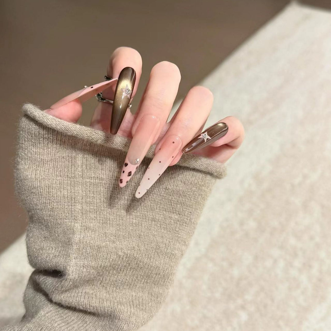 Artistic Stiletto Nail Extensions with Patterned Designs