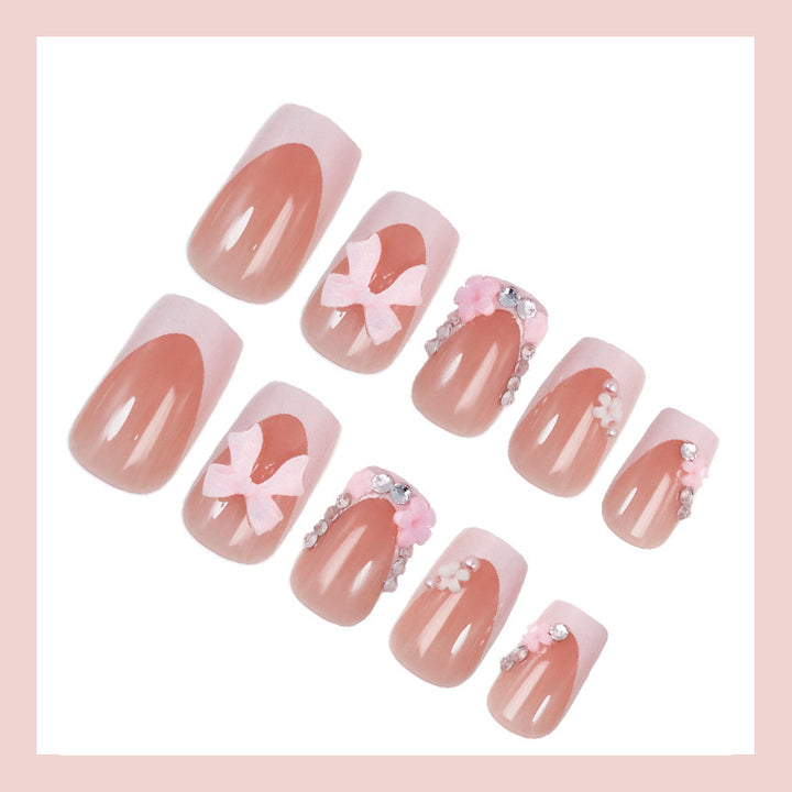 Artificial nail set with playful bows and elegant floral decorations Kalsten