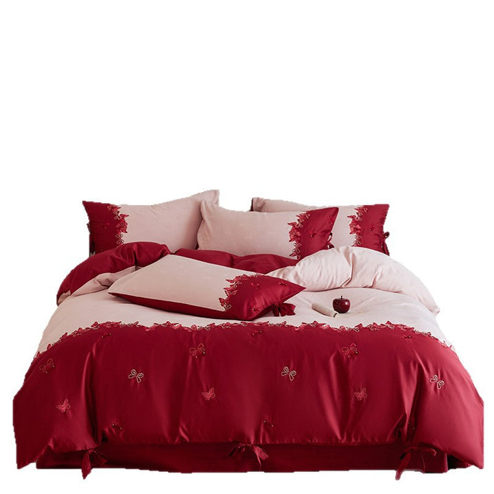 Cotton satin bedding set with butterfly embroidery, decorative bows, and reversible cover