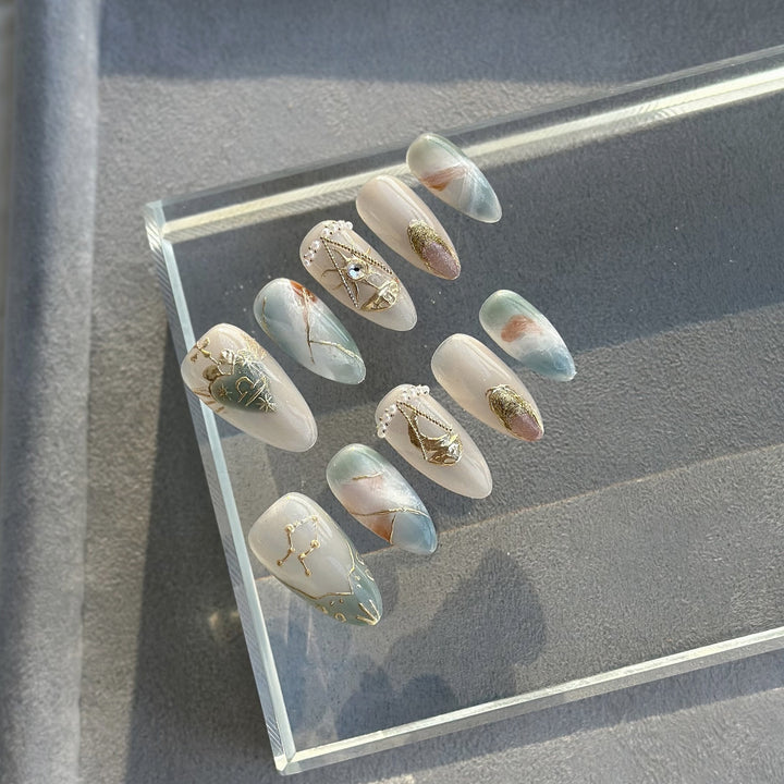 Artistic Press-On Nail Art Set with Celestial and Gem Accents