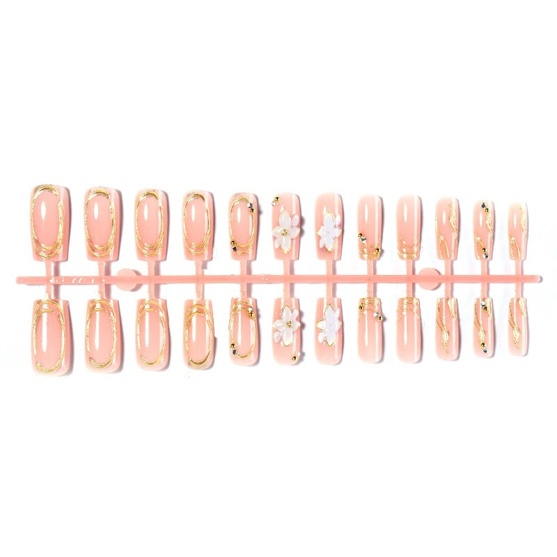 Elegant artificial nail set with decorative flower and gold embellishments Kalsten
