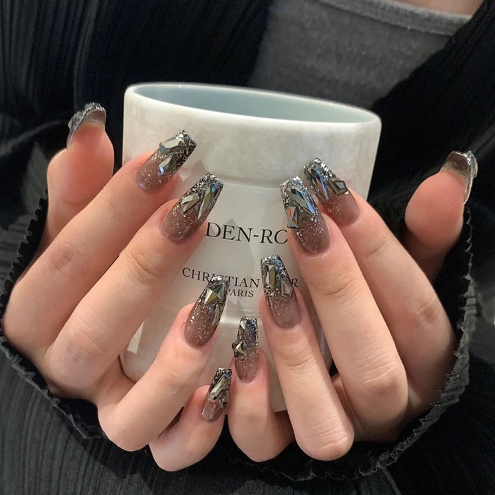 Glamorous artificial fingernails with glitter and moon designs Kalsten