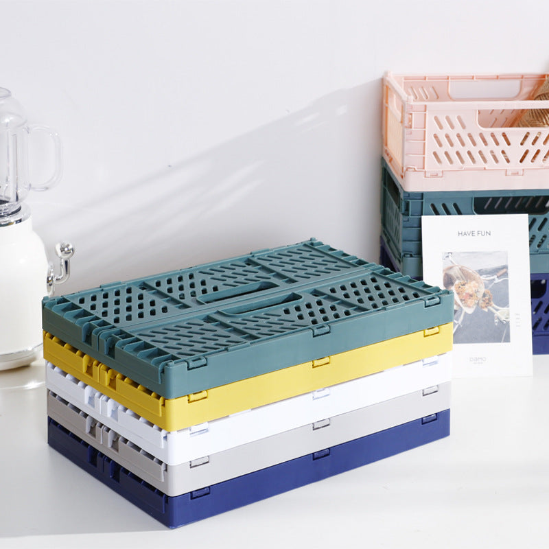 Foldable multi-purpose transport box with ventilation profile and ergonomic grip recesses