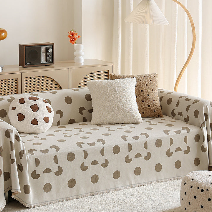three-seater universal protective cover made of jacquard fabric with geometric pattern