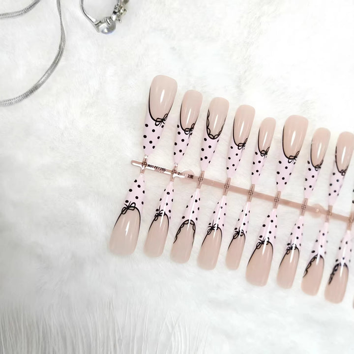 Elegant artificial nails with bow design and dots Kalsten