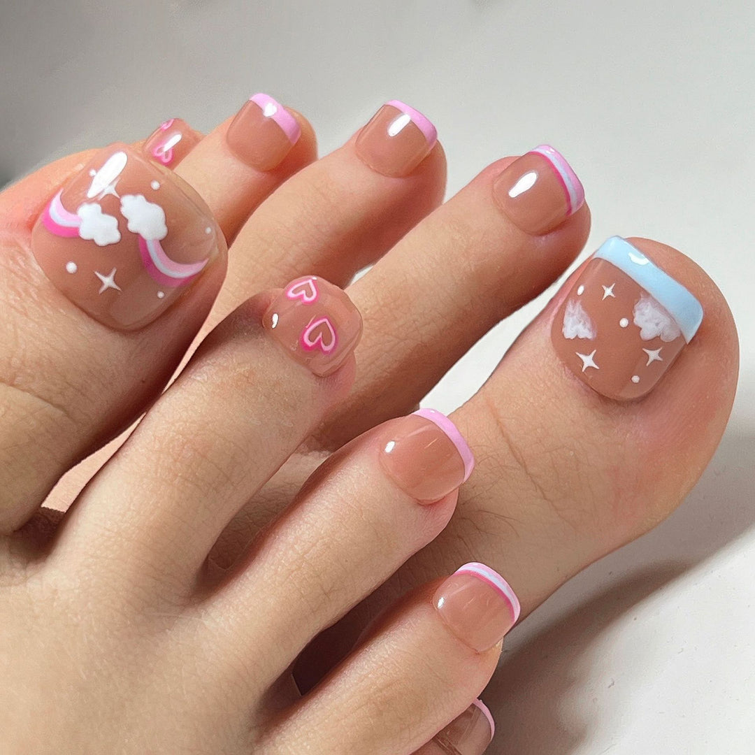 Artful toenail art with heart and cloud motifs Kalsten