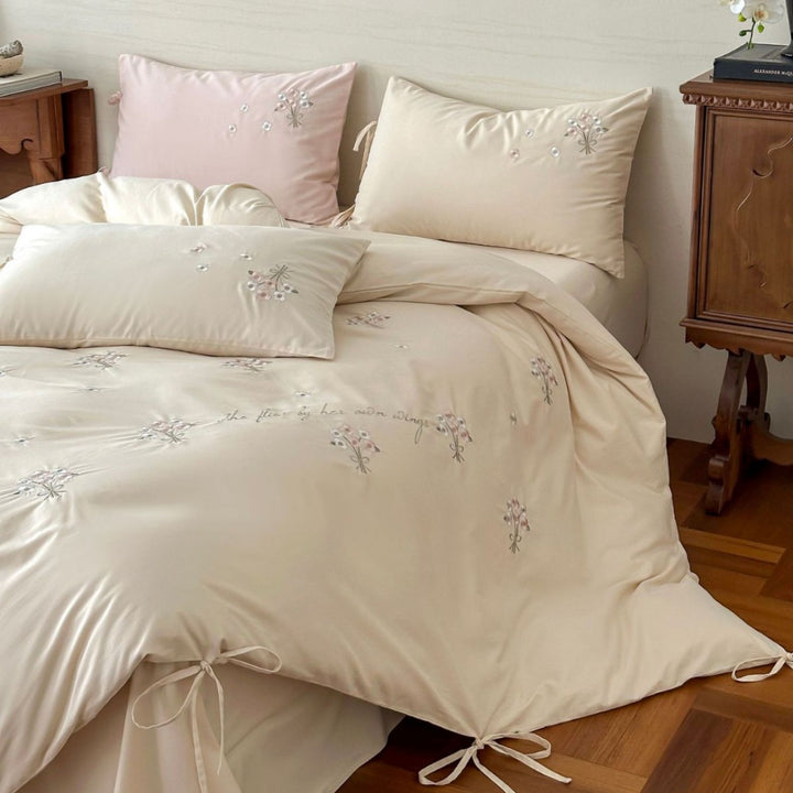 Luxurious satin bedding set with delicate pearl flower embroidery and tie ribbons