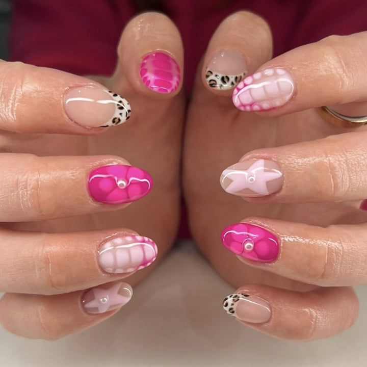 Artful nail art with colorful design and glitter accents Kalsten