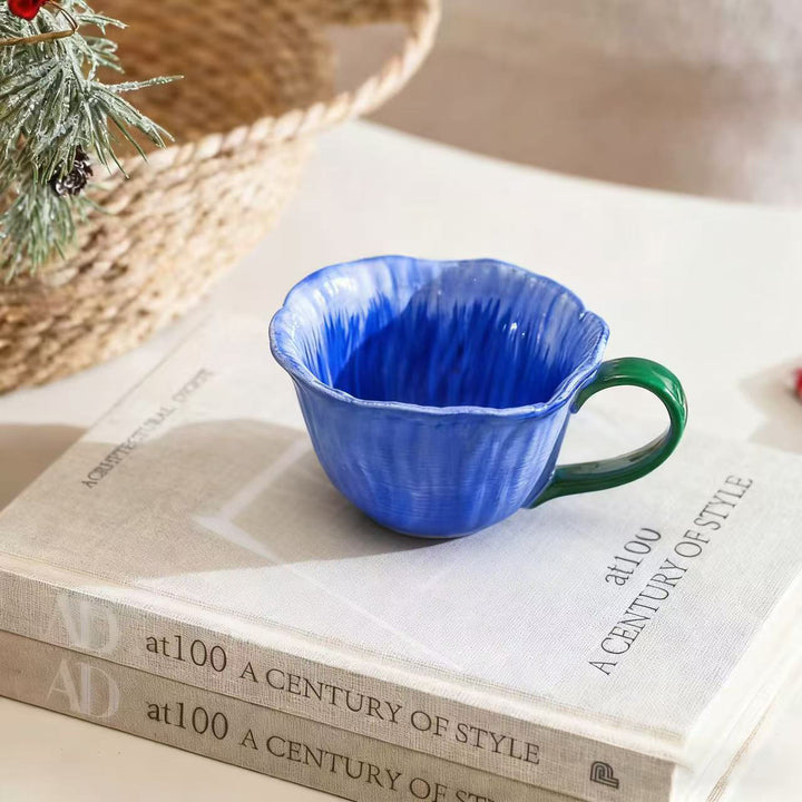 Ceramic mug with saucer in flower shape