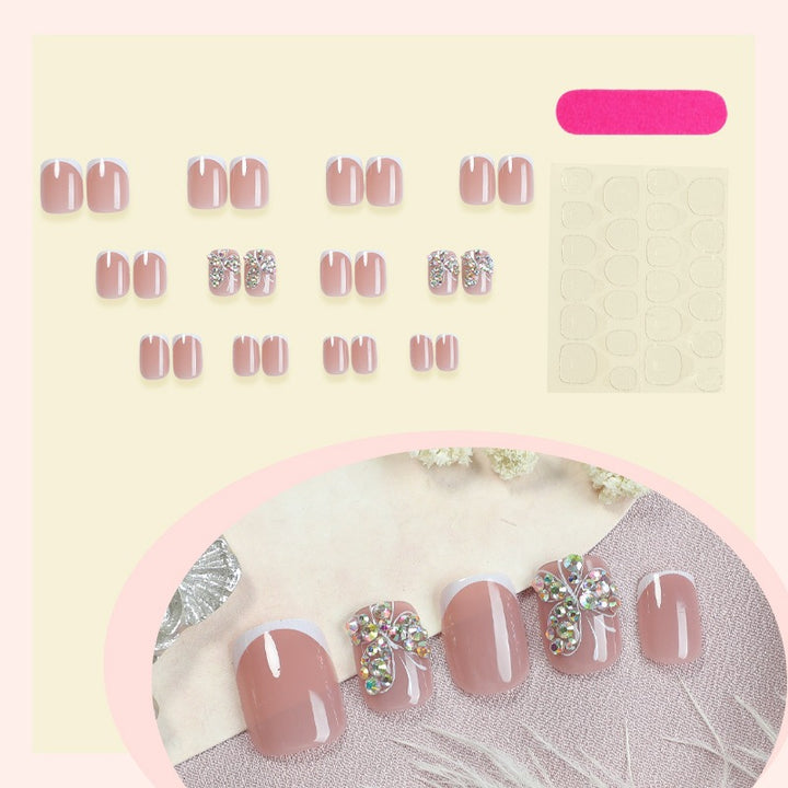 Artifical nail set with sparkling accents and elegant bows Kalsten