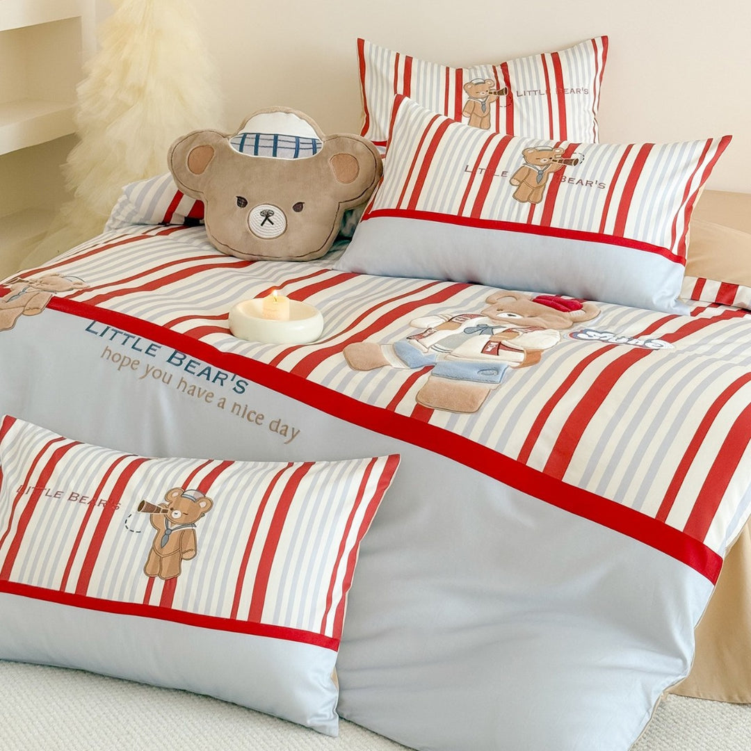 Children's bedding set with embroidered teddy bear design and fine stripes